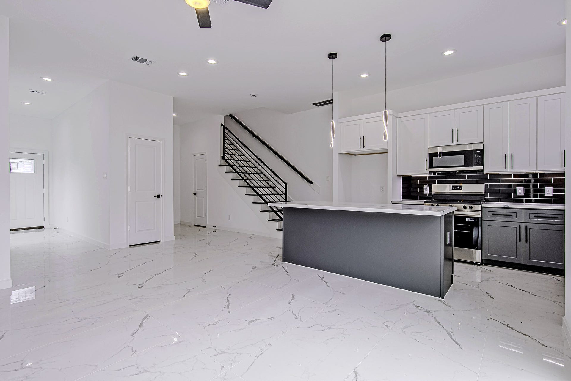 Open living, dining, and kitchen area offering a bright and functional layout.