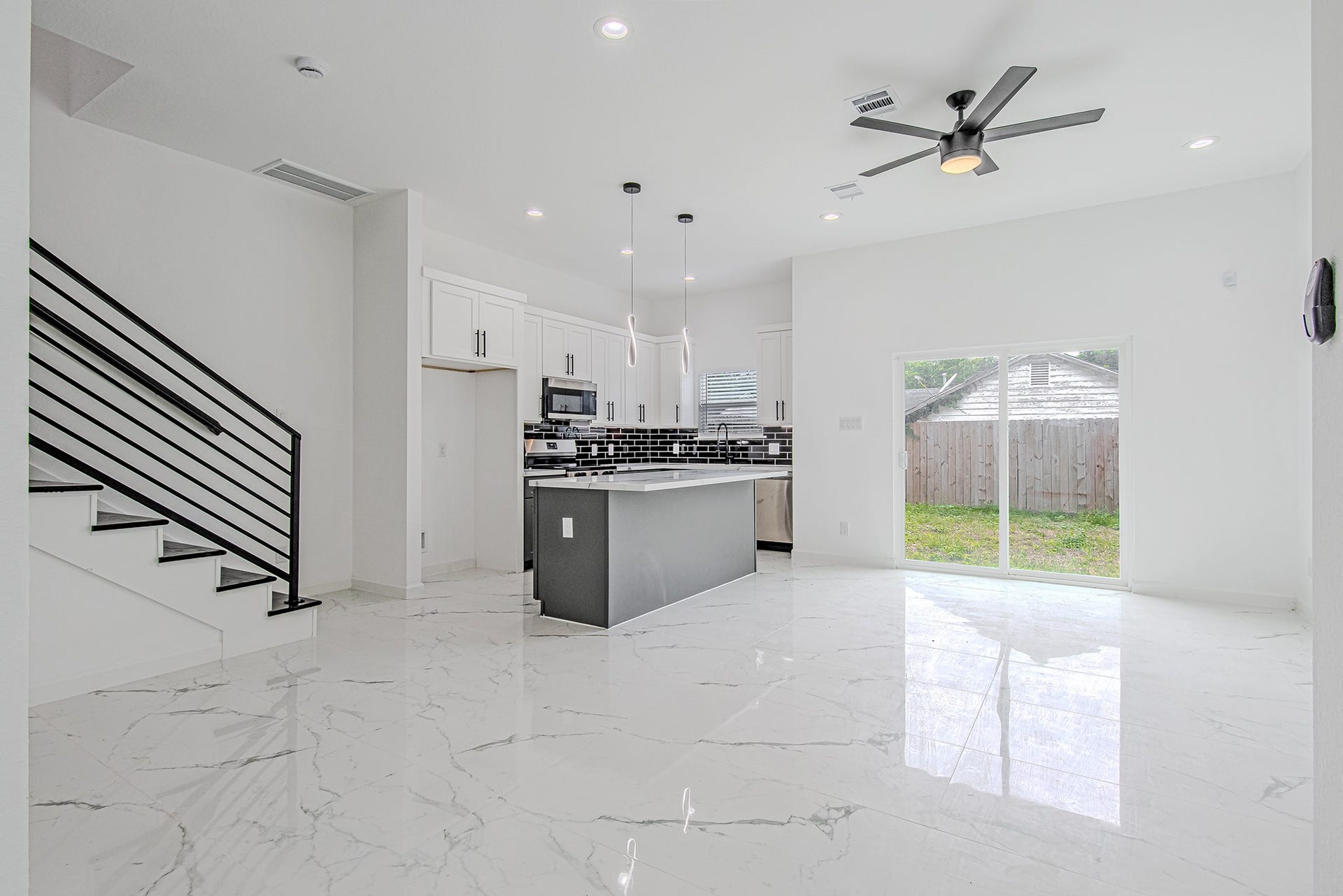 Spacious open living area filled with natural light and seamless flow to the kitchen and dining spaces.