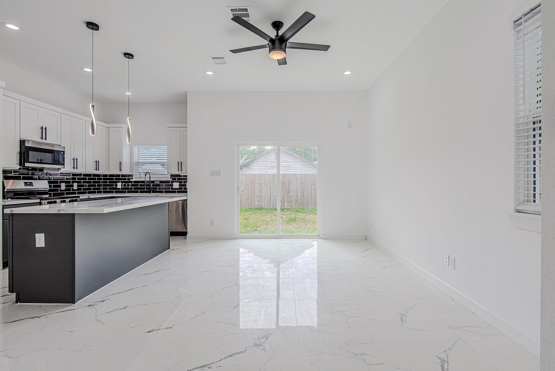 Another view of the expansive living and dining space connected to the kitchen for easy everyday living.