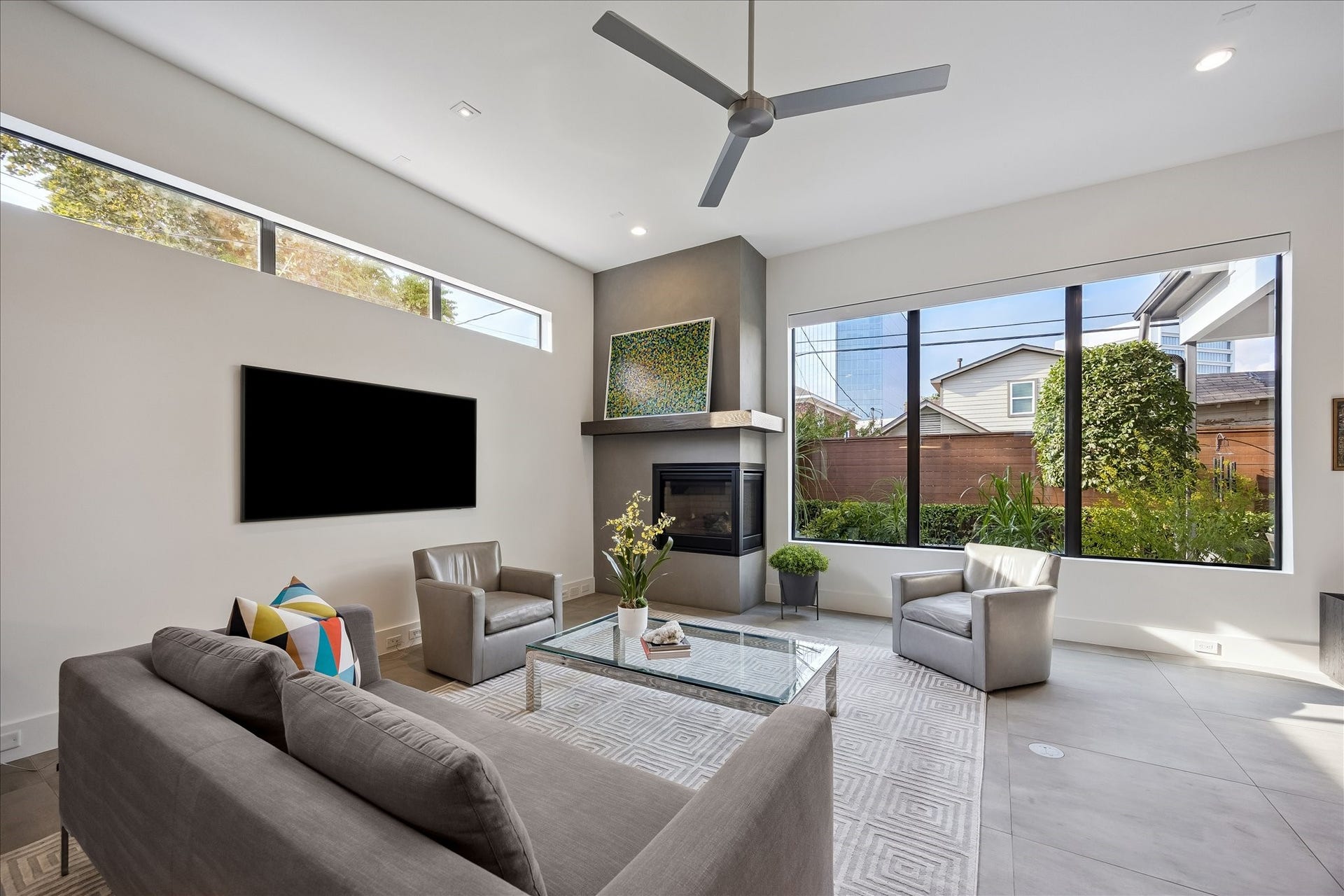 Energy-efficient JELD-WEN argon insulated windows and sleek steel stair railings offer a modern touch. Stylish designer tile and wood flooring ensure durability and elegance throughout the home.