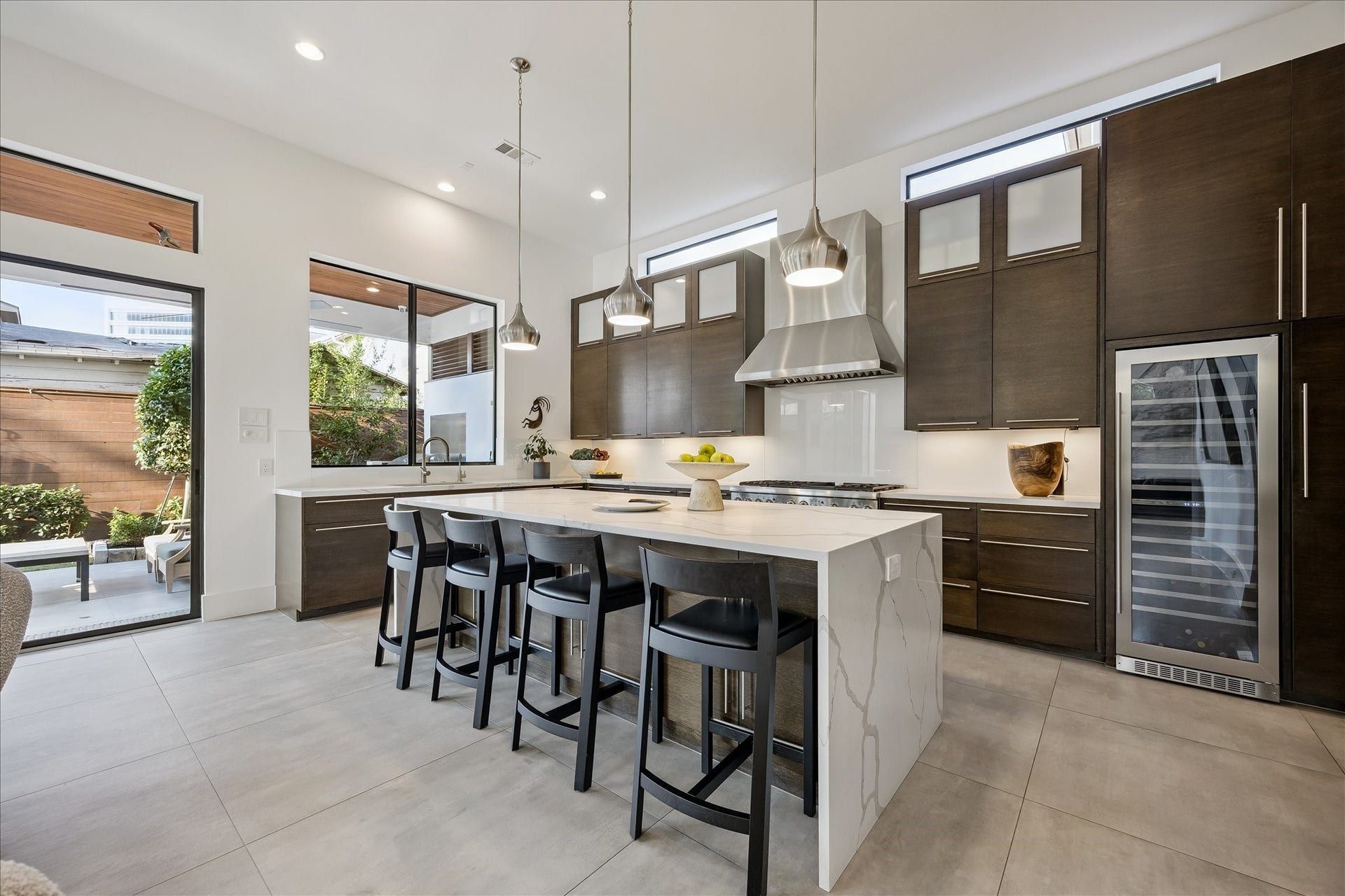 A culinary enthusiast's dream, the kitchen features a Thermador Professional Series appliance package and a built-in wine fridge for your collection.