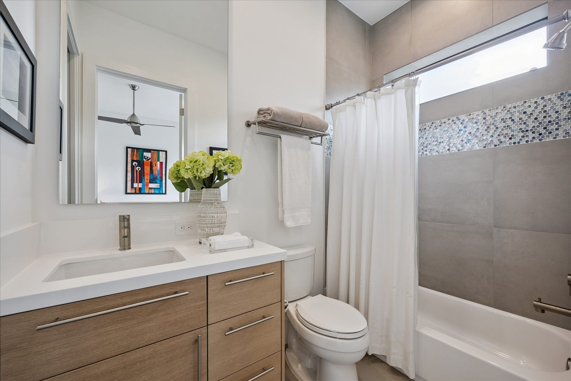 The secondary ensuite bath combines comfort with a spacious walk-in closet for ample storage.