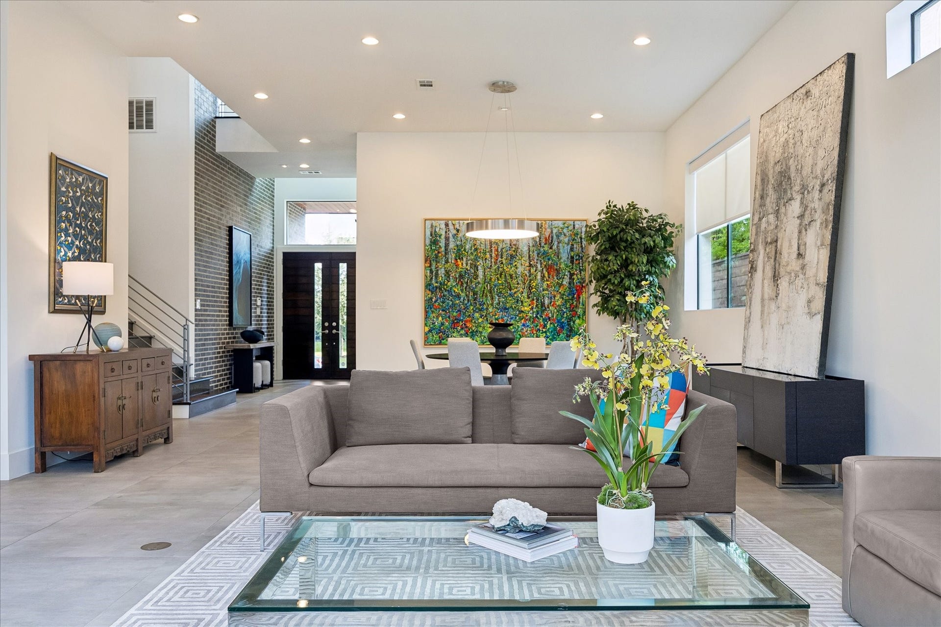 Additional highlights include a two-stage HVAC system for efficient climate control, a security system with four HD exterior cameras and DVR for peace of mind, and indoor/outdoor wired speakers for enhanced entertainment.