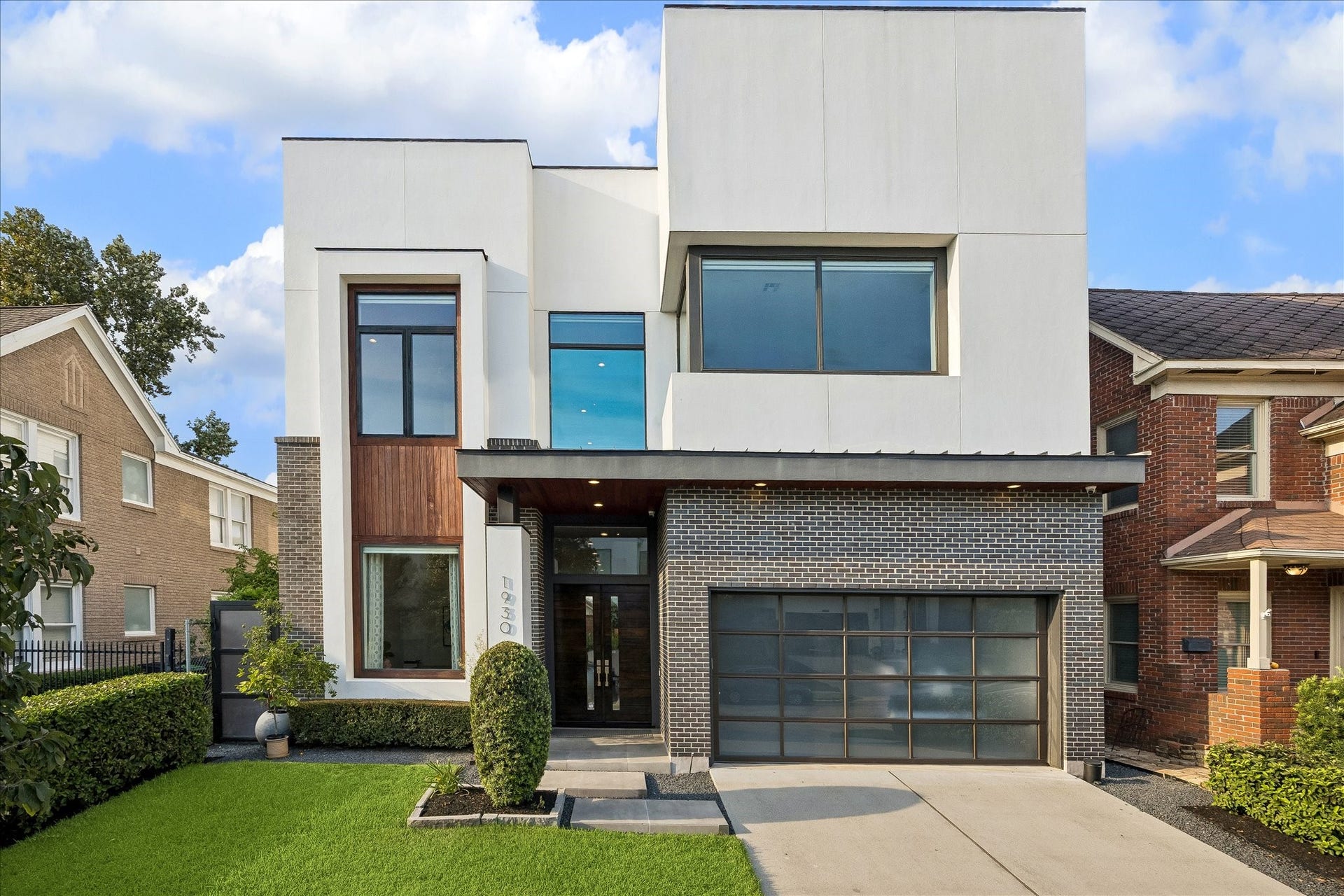 Luxurious Mazzarino-built home in Temple Terrace, featuring 12-foot ceilings and exposed brick walls that highlight the bright, open-concept design.