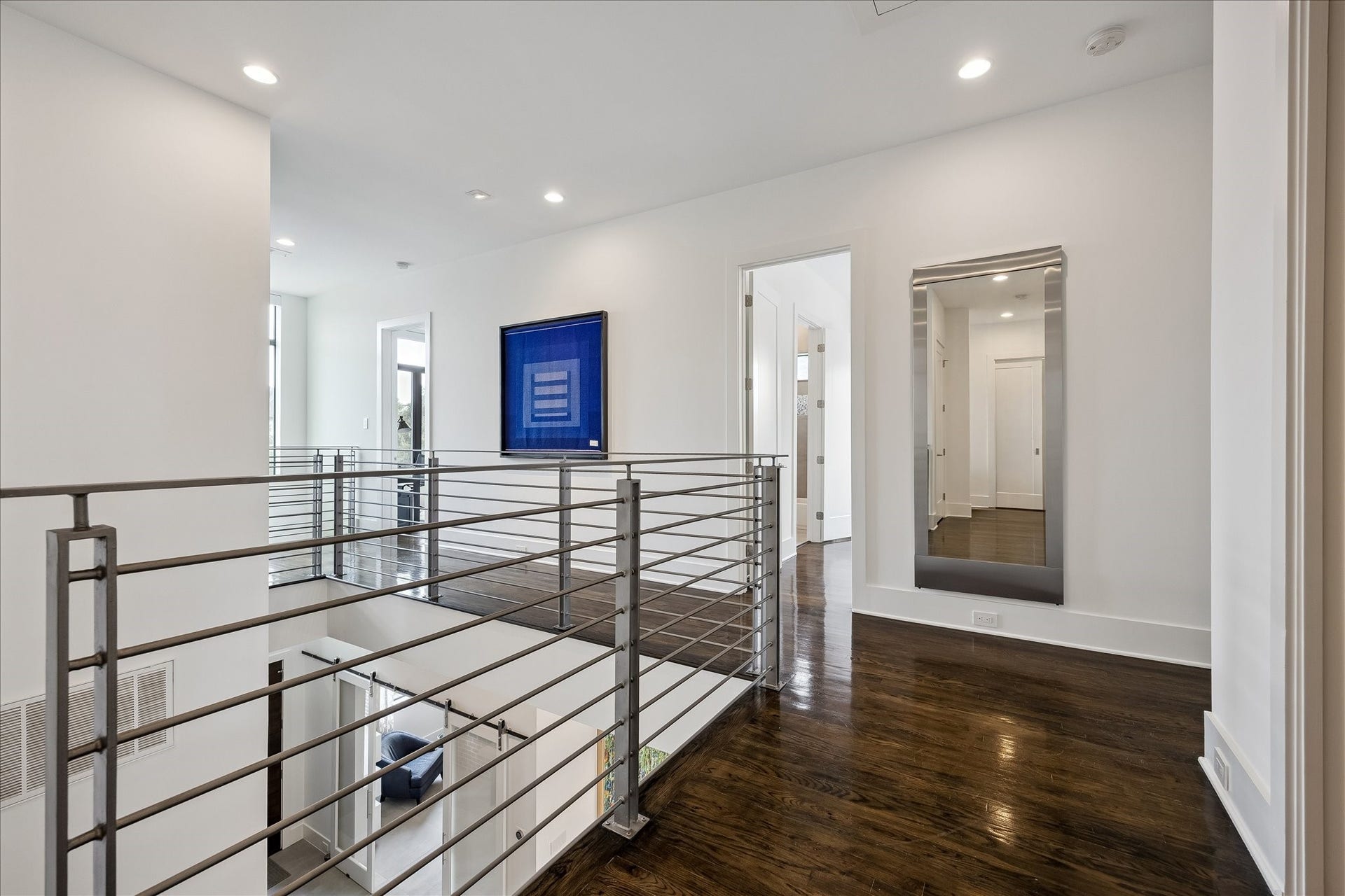 Elegant hardwood floors grace the second level, adding warmth and sophistication.