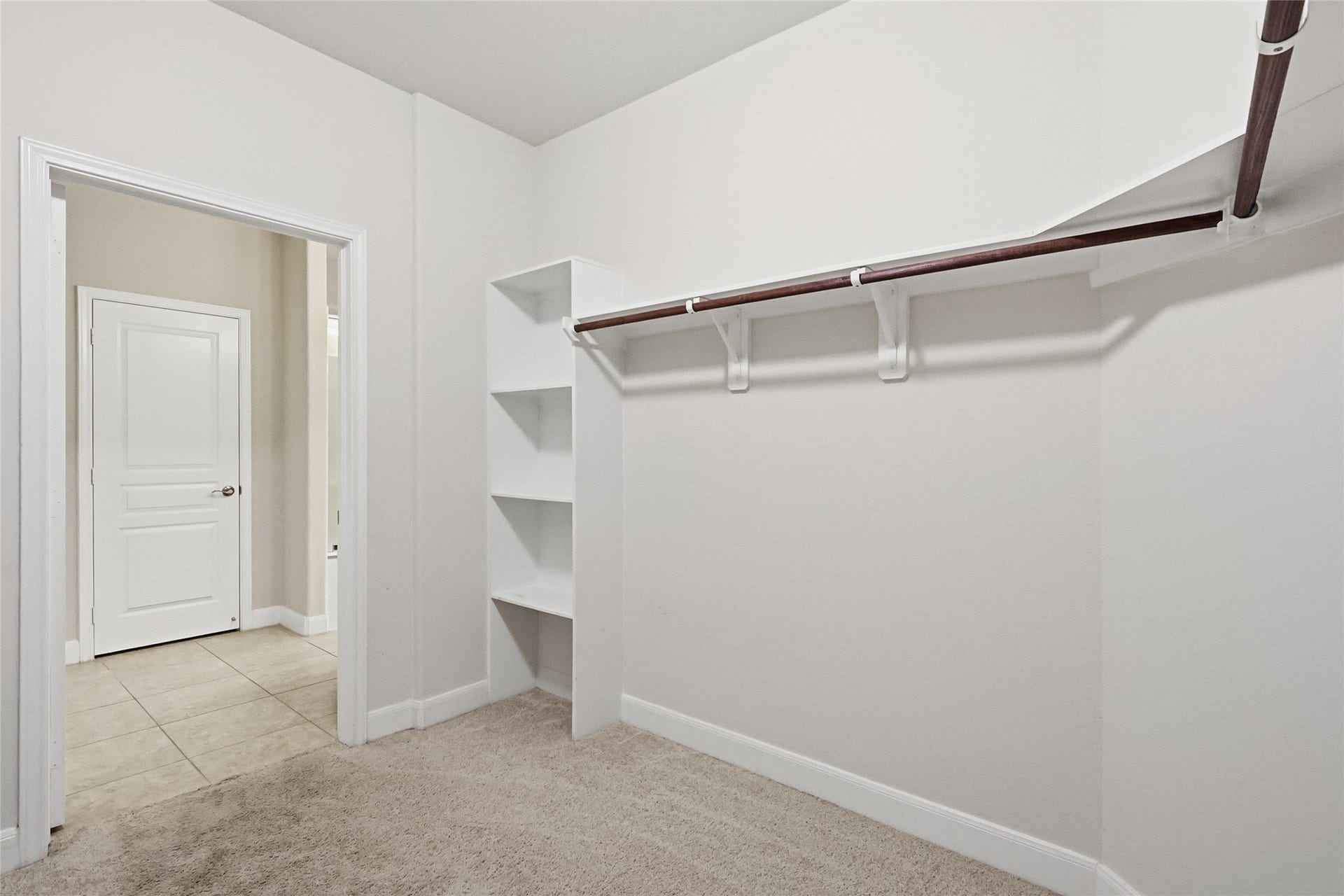 3263 Persimmon Grove, Richmond, TX 77469 Primary closet, view from the back of the closet.
