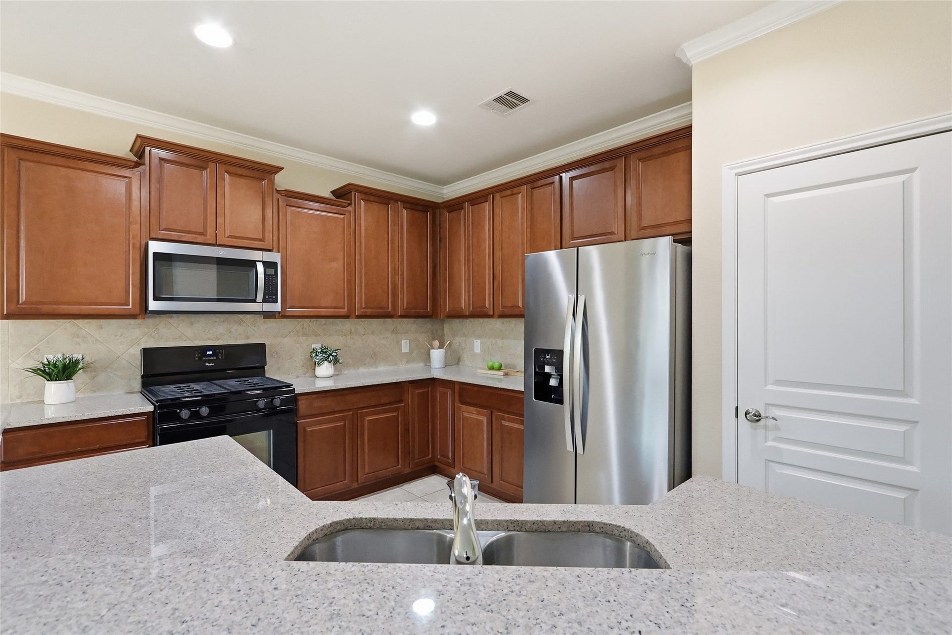 3263 Persimmon Grove, Richmond, TX 77469 View of the kitchen. Lots of stage space above and below the counters and pantry.