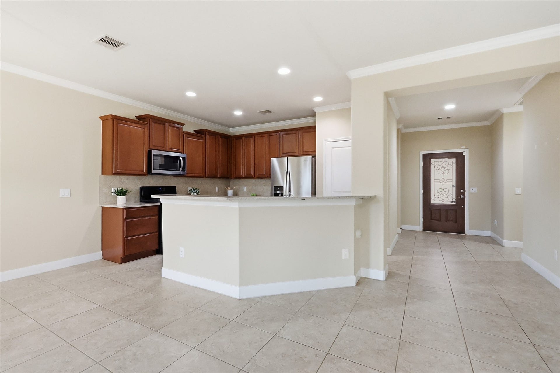 3263 Persimmon Grove, Richmond, TX 77469 View of the kitchen and entryway.