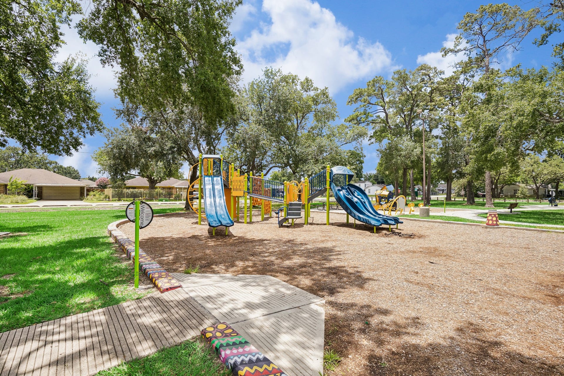 The community playground offers a fun and engaging space for children while providing a welcoming environment for families. Combined with the surrounding green space and walking areas, the park serves as a central gathering place for residents.