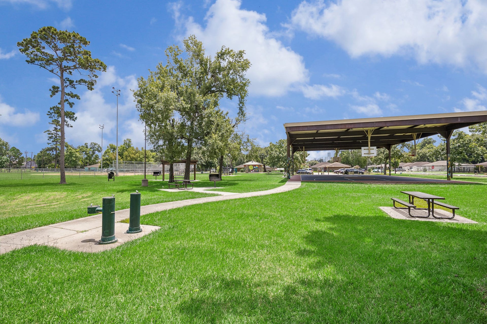 The nearby park features picnic areas, mature shade trees, and well-maintained athletic fields, creating an ideal environment for outdoor relaxation and recreation. Enjoy weekend games, family picnics, or simply taking in the open green space.