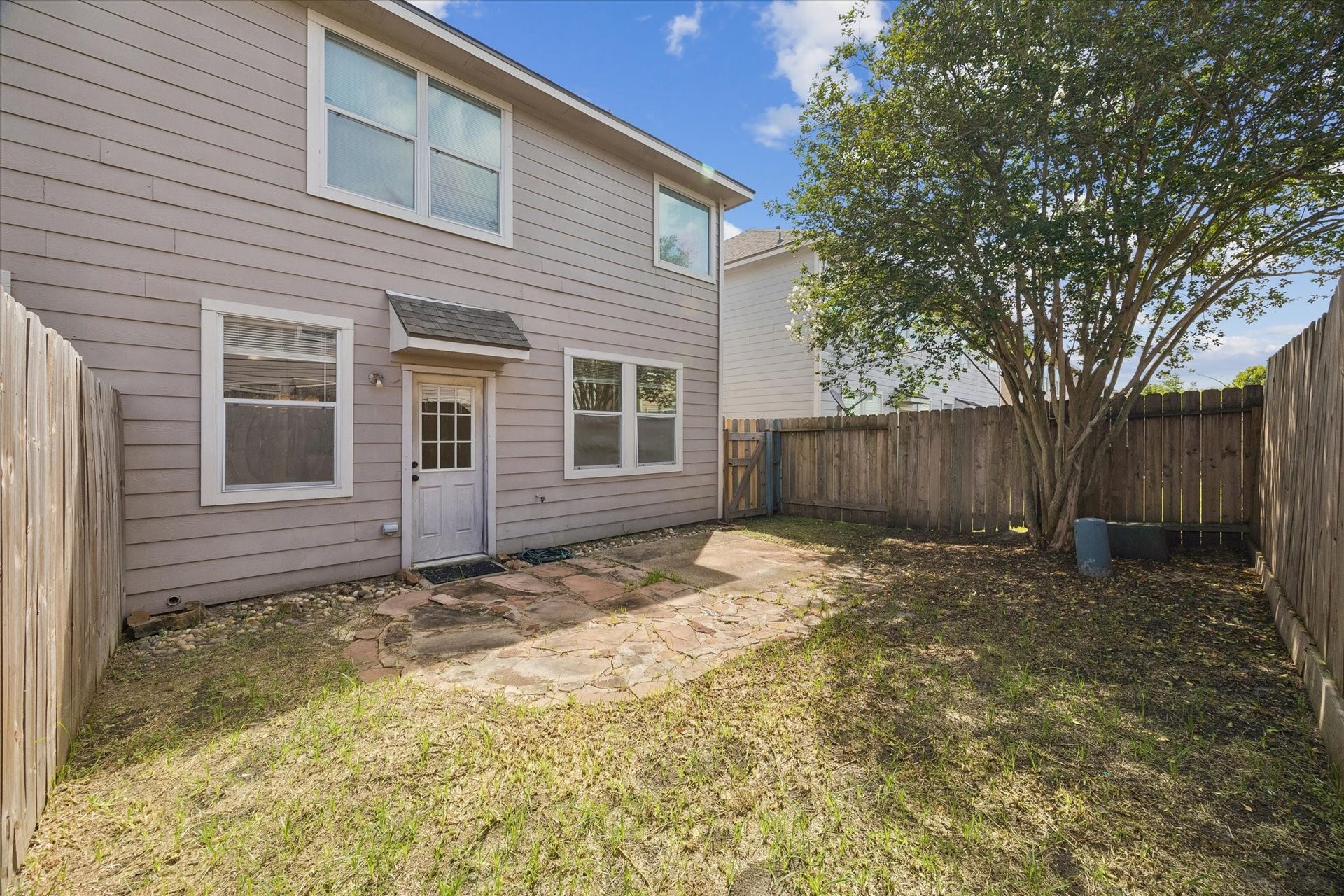 6051 Yorkglen Manor Lane, Houston, TX 77084 Fully fenced backyard offers privacy and space to relax or entertain