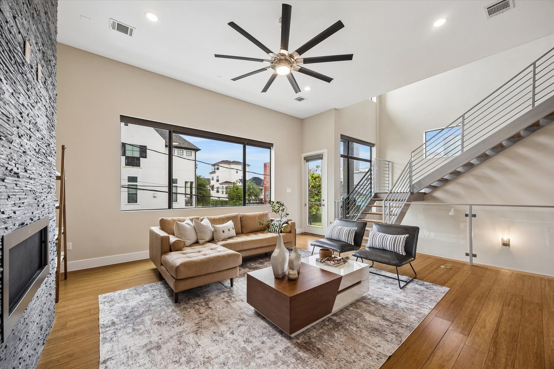 This sunken living room is made for the way you want to live, whether that means slow mornings, rowdy game nights, movie marathons, or easy evenings with friends. With balcony access, a soaring ceiling, and a connected feel to the rest of the home, it brings comfort and energy together in one unforgettable space.