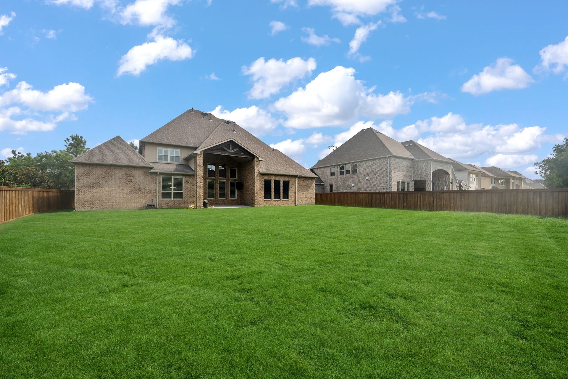 This huge pool sized backyard is a blank canvas for the future owner.