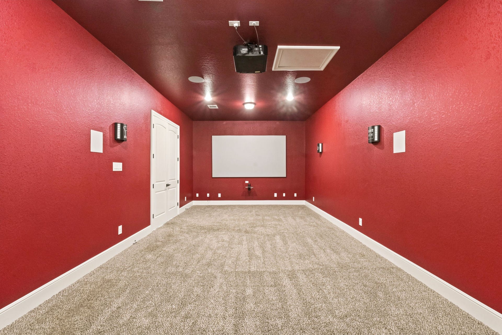 Media room with theater lighting and digital surround sound speakers.