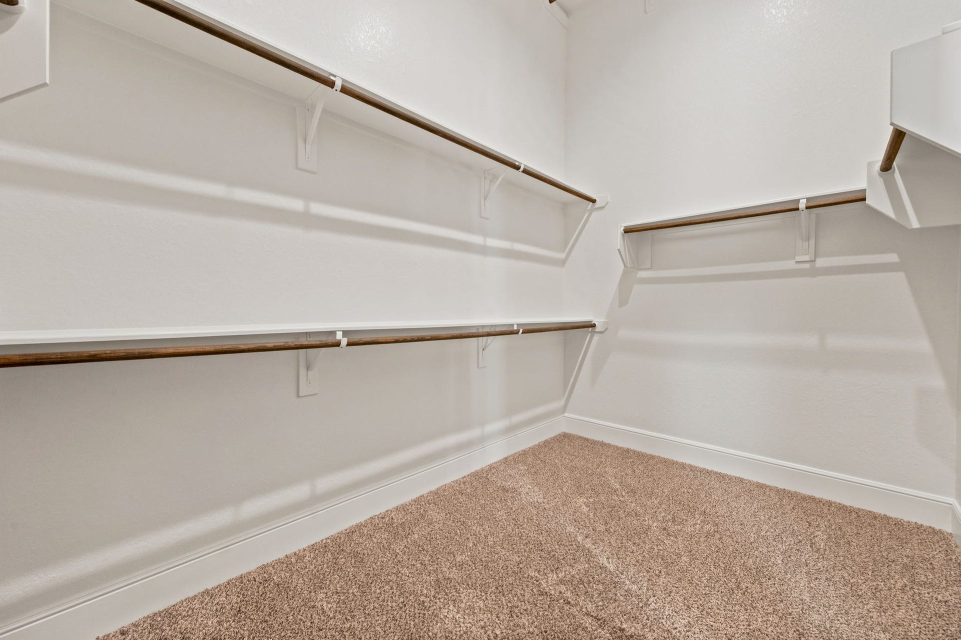1 of 2 large walk-in closets in Primary bedroom.