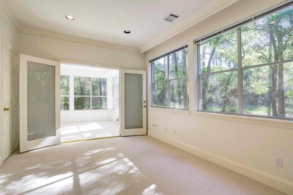 10210 Winding Wood Lane, Tomball, TX 77375 Primary sitting area opens to sunroom