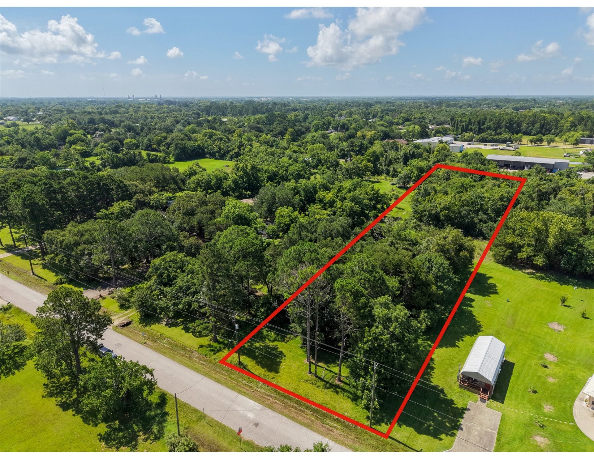 Clearly outlined from above, the 1.56-acre property offers approximately 67,997 sq. ft. of land surrounded by the spacious, low-density character that makes Santa Fe appealing. Mature trees provide a beautiful natural framework for future construction, while the long 111'  612' configuration creates room to separate a residence from accessory buildings, recreation areas or other improvements.