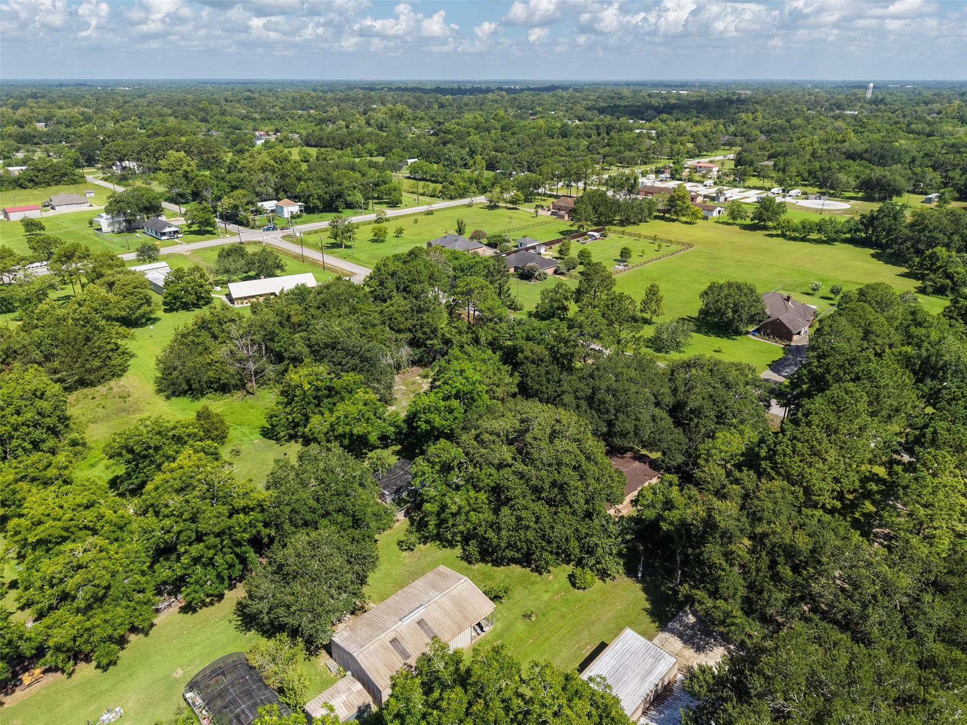 From this vantage point, the area's spacious development pattern is particularly apparent. Homes and accessory buildings are interspersed with mature woods, lawns and open acreage rather than tightly packed lots. The subject property's 1.56 acres fit naturally into this setting and provide the opportunity to create a residence with substantial outdoor space, privacy and room for future needs.