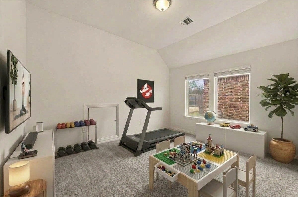 4423 Parkwater Cove Court SE, Sugar Land, TX 77479 This room offers a bright and spacious play area with a vaulted ceiling, carpeted floor, and ample natural light from two large windows. It can also be used as a spare guest room