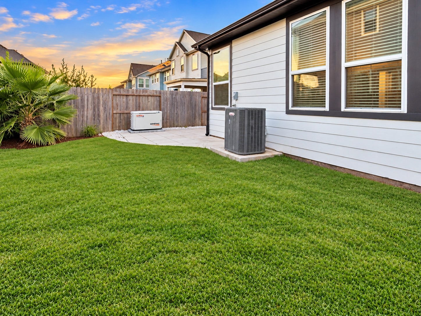 9407 Lantern Light Drive, Missouri City, TX 77459 Beautiful backyard with green lawn, privacy fencing, and an extended patio for outdoor enjoyment. Lennox A/C.