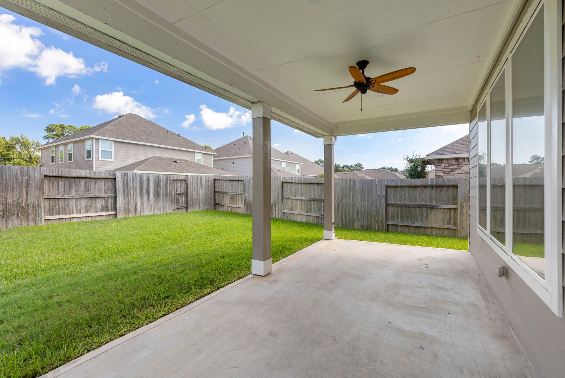 8731 Ute Creek Lane, Magnolia, TX 77354 haded outdoor living space, perfect for relaxing or entertaining.