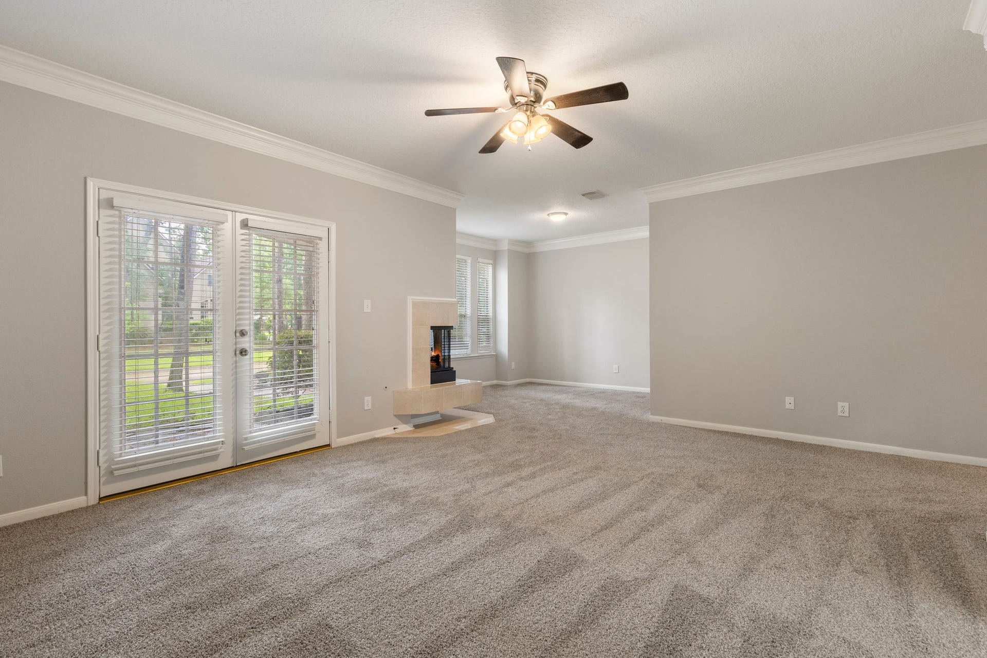 27 Stargazer Place, The Woodlands, TX 77381 The are double doors which open into the front yard and offer natural light.