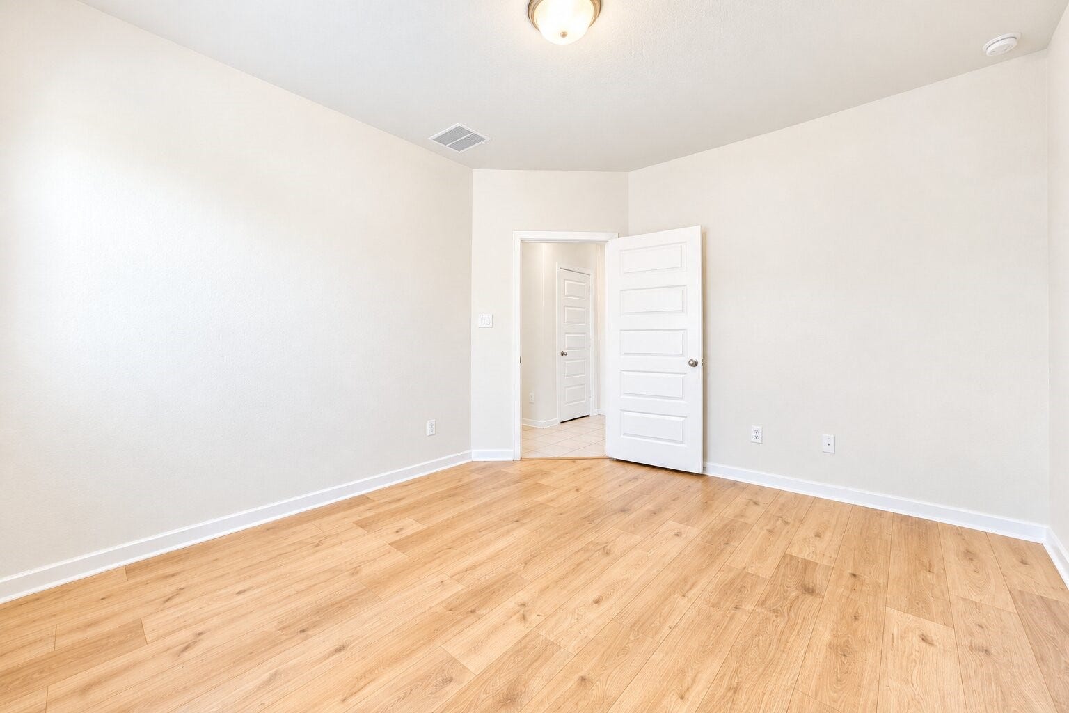 8106 Colony Chase Court, Richmond, TX 77407 Bedroom featuring wood-look flooring and neutral finishes.