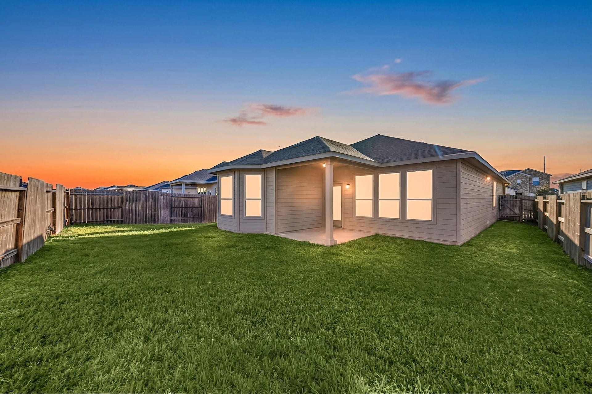 8106 Colony Chase Court, Richmond, TX 77407 Beautiful rear exterior view of the home at sunset.