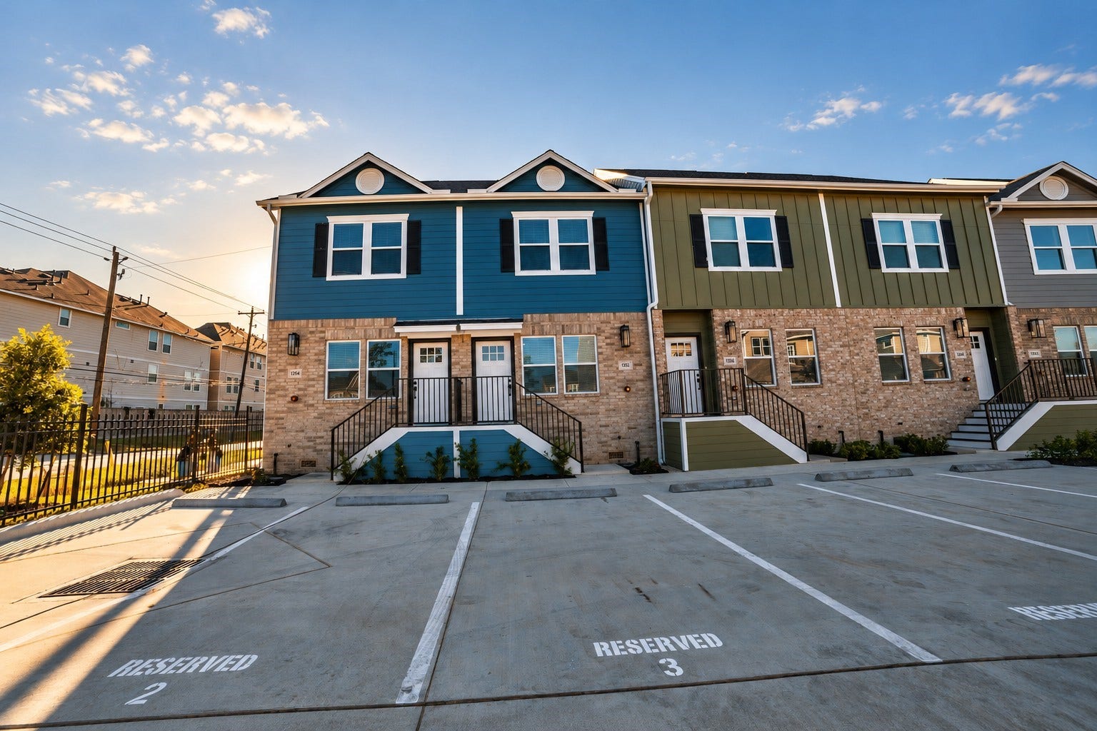 3252 Creekmont Drive, Houston, TX 77091 Charming townhouse with a modern exterior, featuring a mix of siding and brick accents. Ample reserved parking in front adds convenience in a well-maintained community setting.