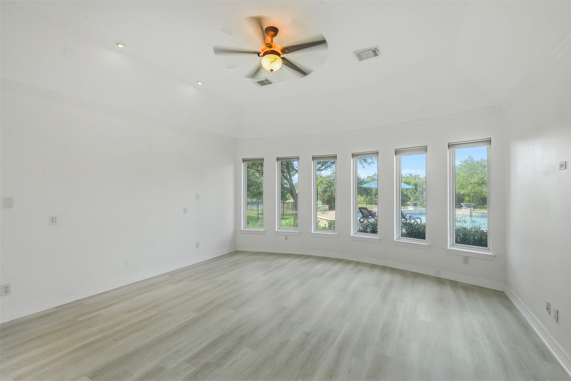 21018 W Farwood Terrace, Cypress, TX 77433 Primary Bedroom with view of pool and preserve area.