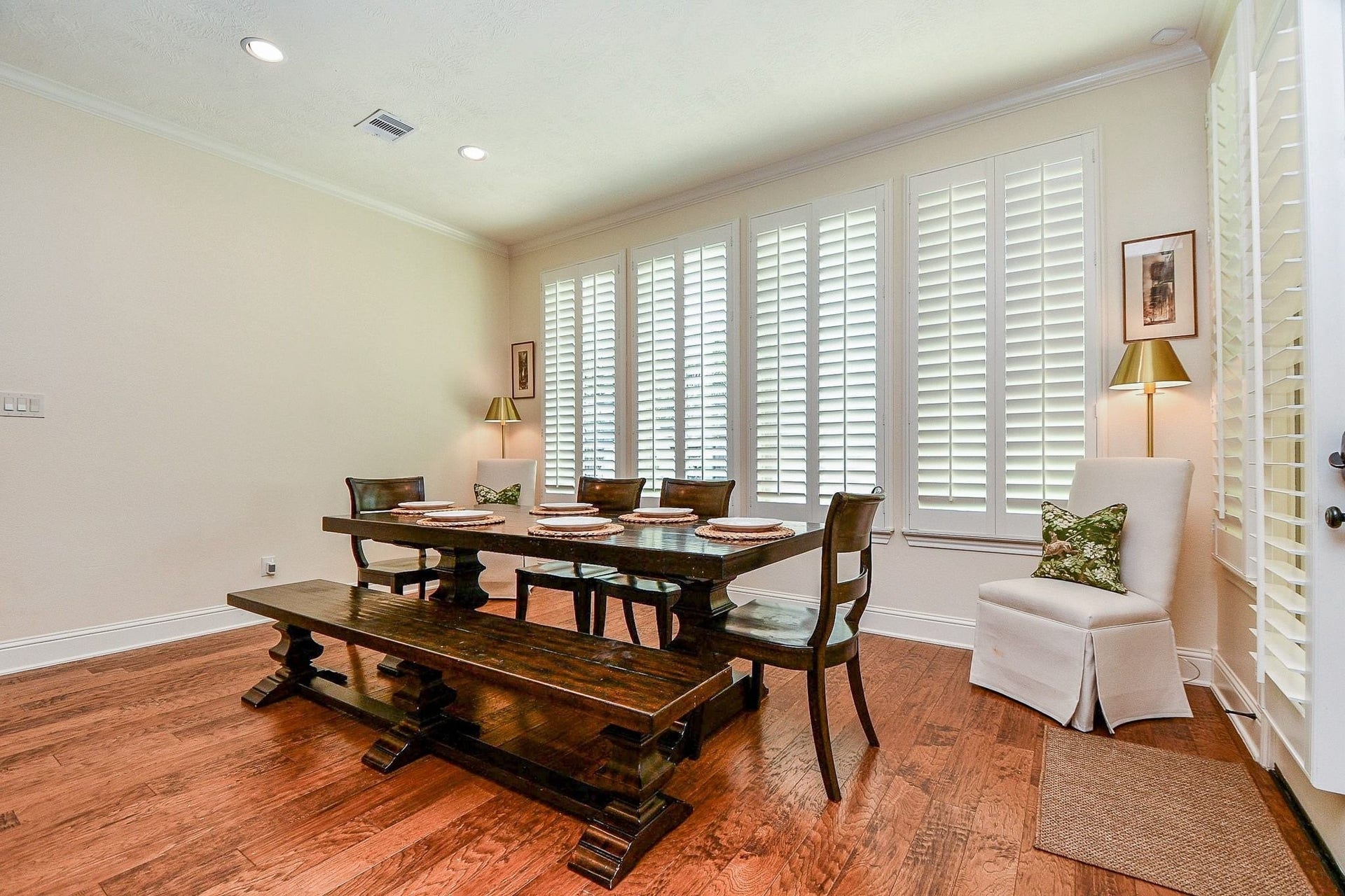 11410 Sardinia Drive, Richmond, TX 77406 This spacious dining area comfortably accommodates a large dining table with plenty of room for additional furniture. Keep the plantation shutters closed for a warm, intimate atmosphere or open them to enjoy beautiful views of the backyard oasis.