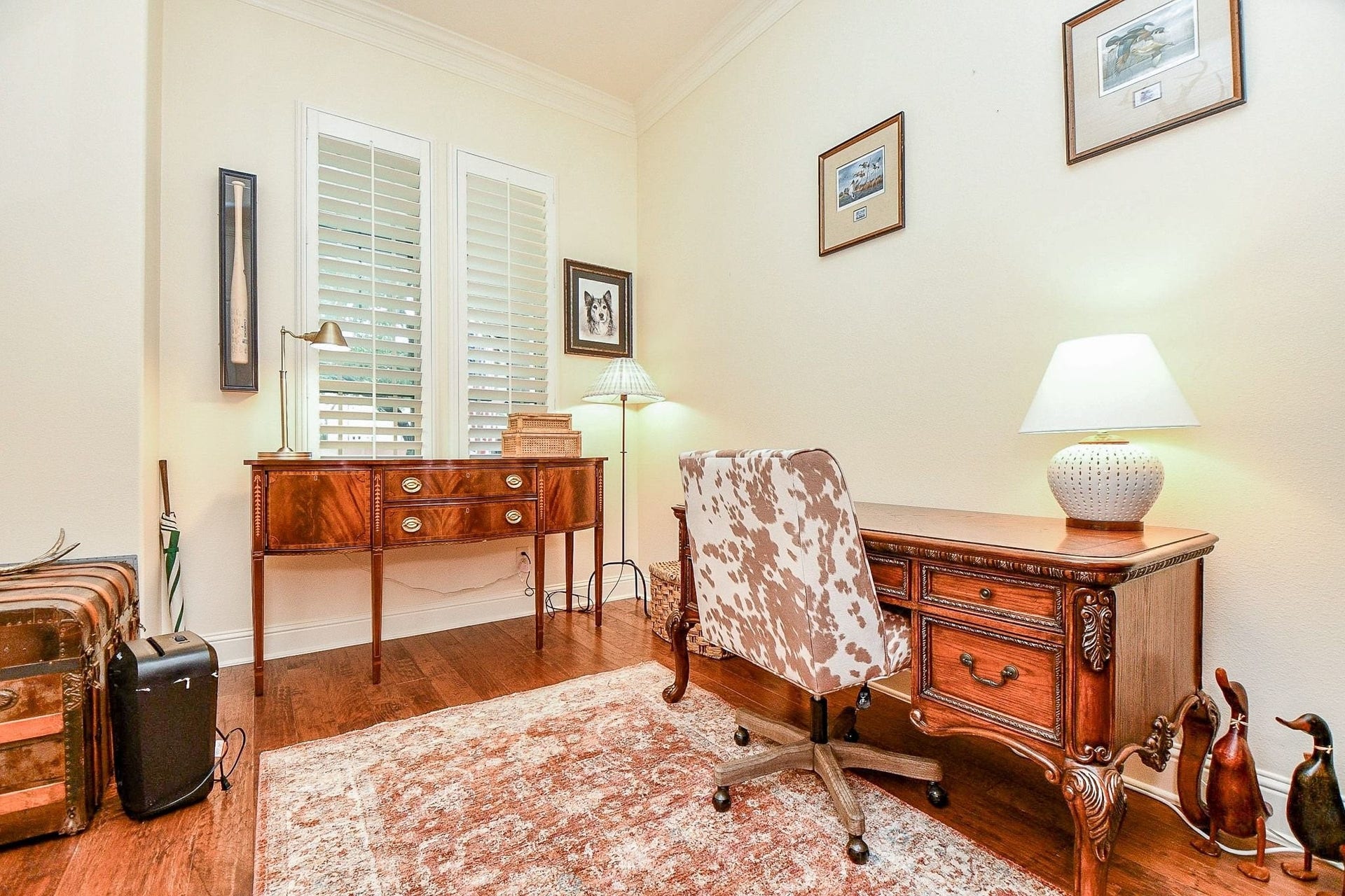 11410 Sardinia Drive, Richmond, TX 77406 The welcoming home office is thoughtfully appointed with plantation shutters, elegant crown molding, and a spacious closet providing plenty of storage.