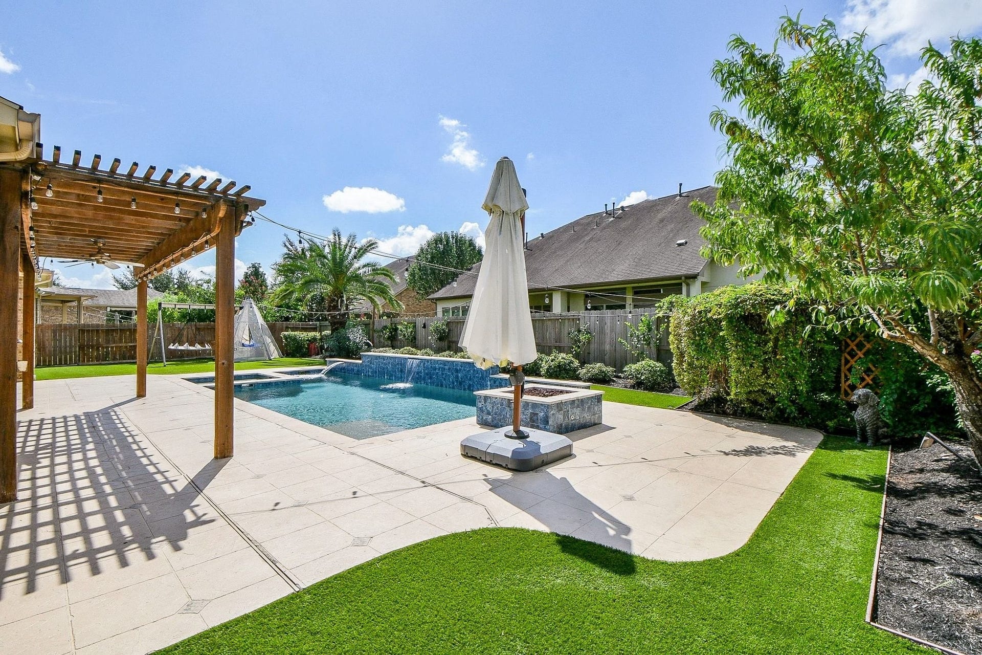 11410 Sardinia Drive, Richmond, TX 77406 Both sides of the pool offer extended concrete areas, providing plenty of space for sun loungers and comfortable seating areasperfect for relaxing or entertaining. A mature peach tree adds a special touch and produces an abundance of peaches each year!