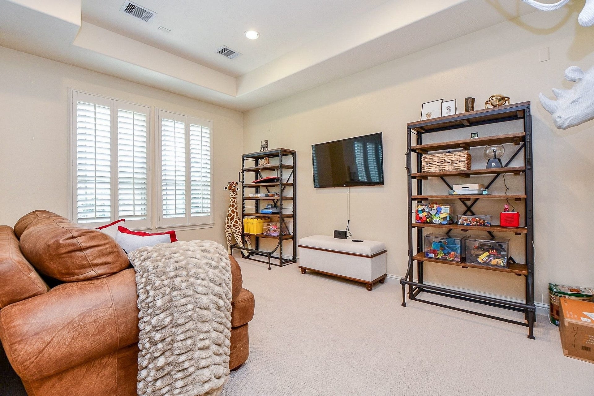 11410 Sardinia Drive, Richmond, TX 77406 A look into the second section of the game room. While slightly smaller than the adjoining space, this generous area still offers plenty of room for a variety of uses, whether for entertaining, hobbies, a playroom, or additional seating.
