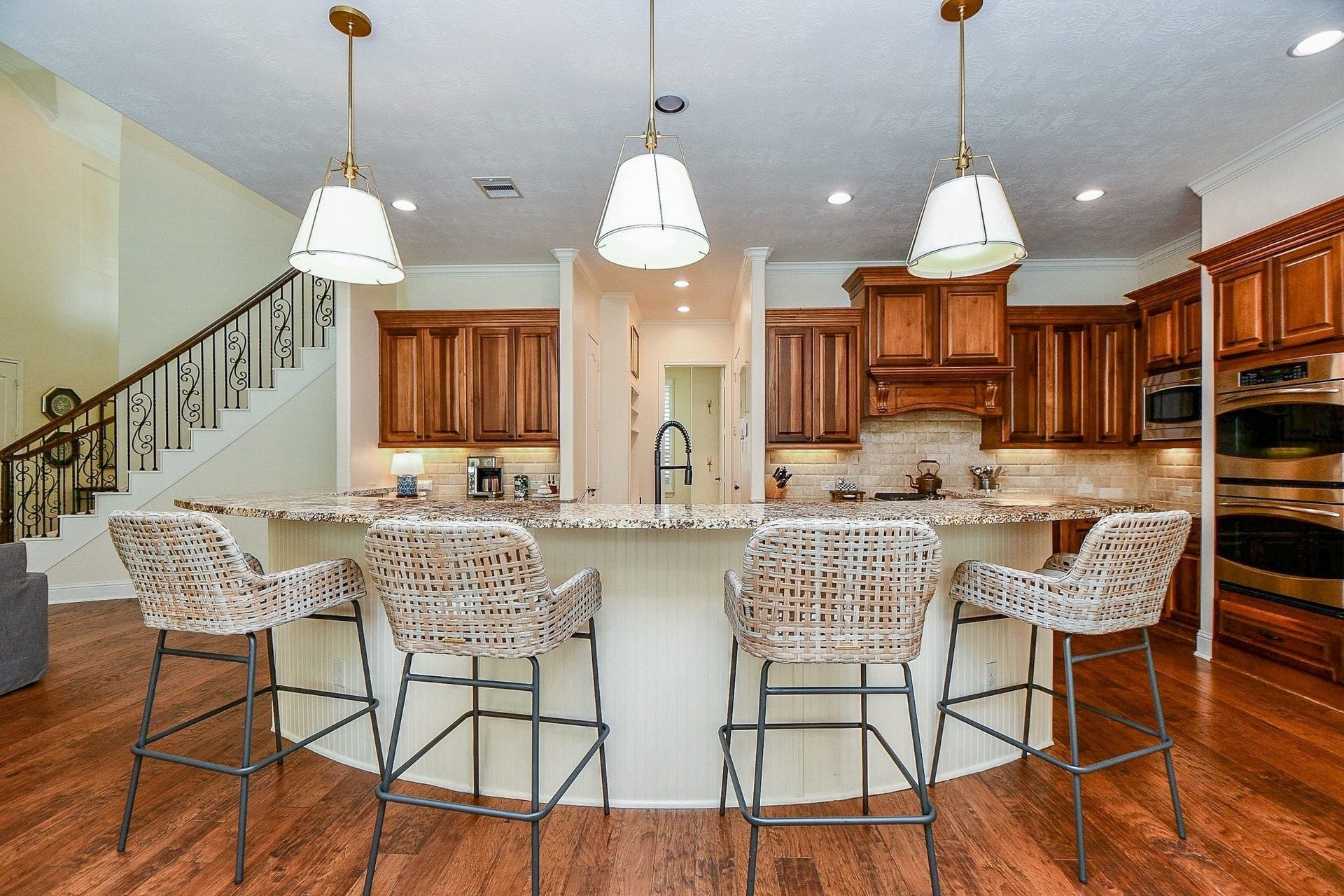 11410 Sardinia Drive, Richmond, TX 77406 The luxury continues into the kitchen, featuring a massive island, gorgeous cabinetry, and beautifully coordinated countertops and backsplash for a timeless, sophisticated look.