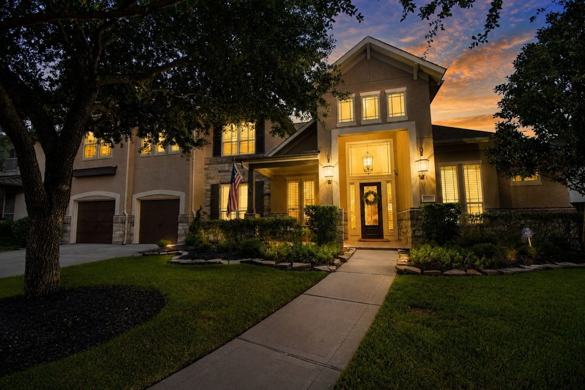 11410 Sardinia Drive, Richmond, TX 77406 The exterior truly comes to life at night with stunning accent lighting. The beautifully contrasting front door creates an inviting focal point, while the spacious 3-car tandem garage features durable epoxy flooring.