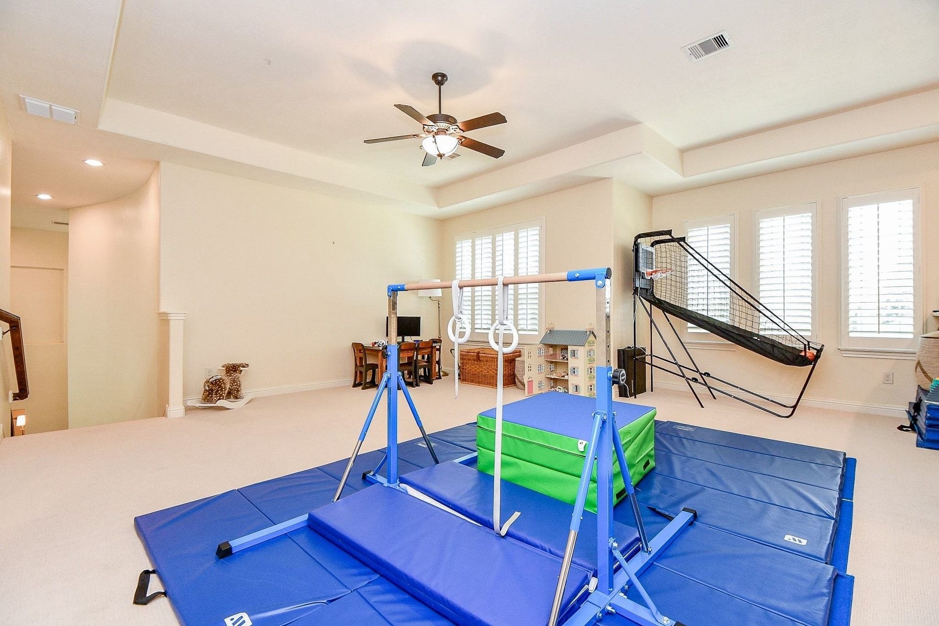 11410 Sardinia Drive, Richmond, TX 77406 A view toward the staircase showcases just how much space this expansive upstairs area offers. Plantation shutters continue throughout the upper level, adding a polished, luxurious touch and creating a cohesive look throughout the home.