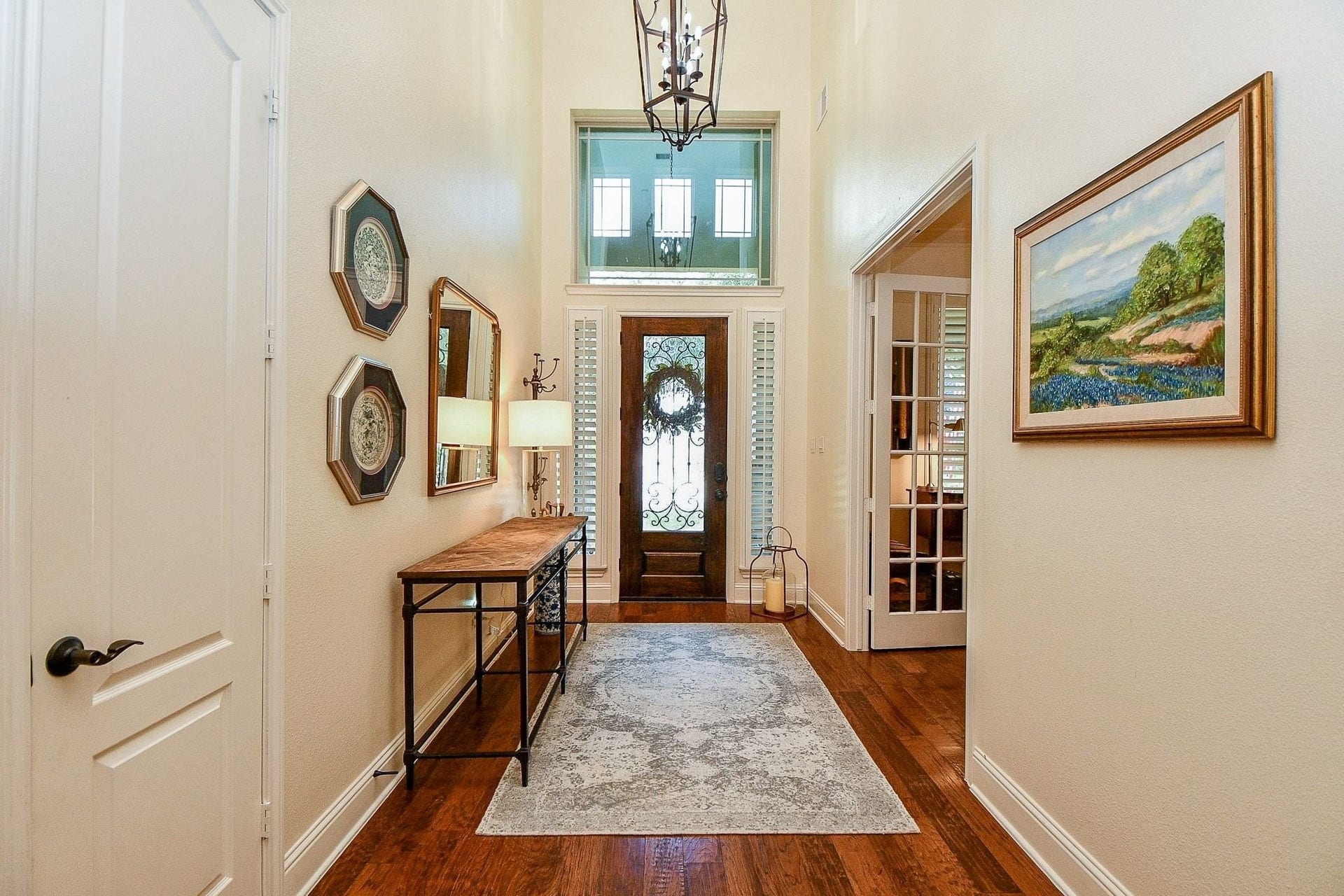 11410 Sardinia Drive, Richmond, TX 77406 A beautiful view toward the grand entry highlights the stunning front door, featuring frosted glass that fills the space with natural light while maintaining privacy.