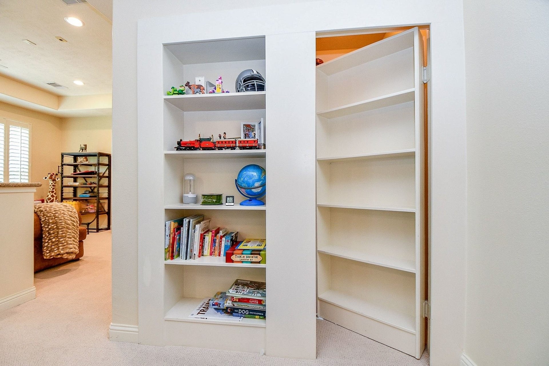 11410 Sardinia Drive, Richmond, TX 77406 Tucked behind the bookshelf is a hidden room offering a fun and unique bonus spaceperfect for a cozy reading nook, private retreat, or expansive storage area.