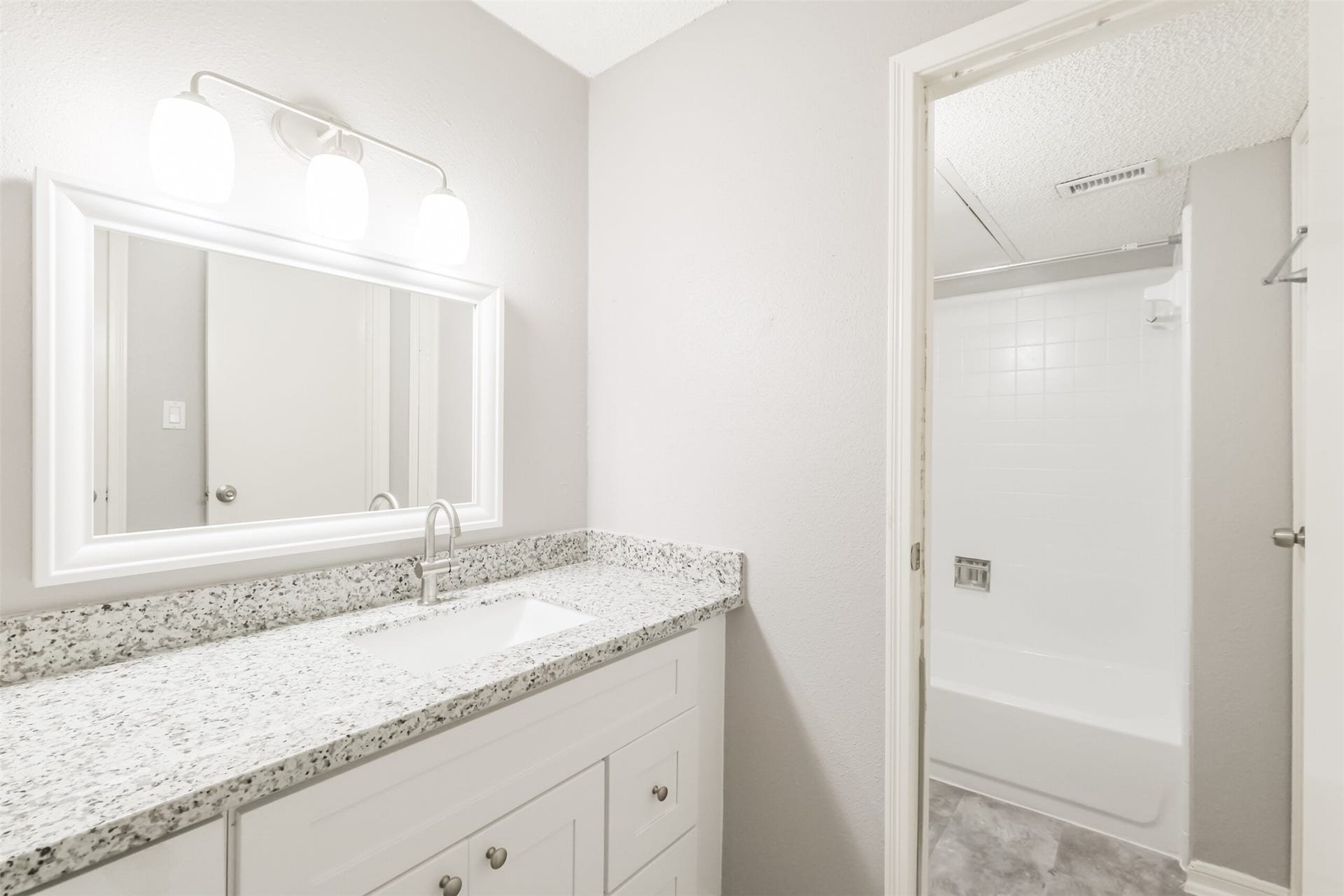 3100 Jeanetta Street, #1204, Houston, TX 77063 Updated bathroom with granite countertop, conveniently accessible for guests!