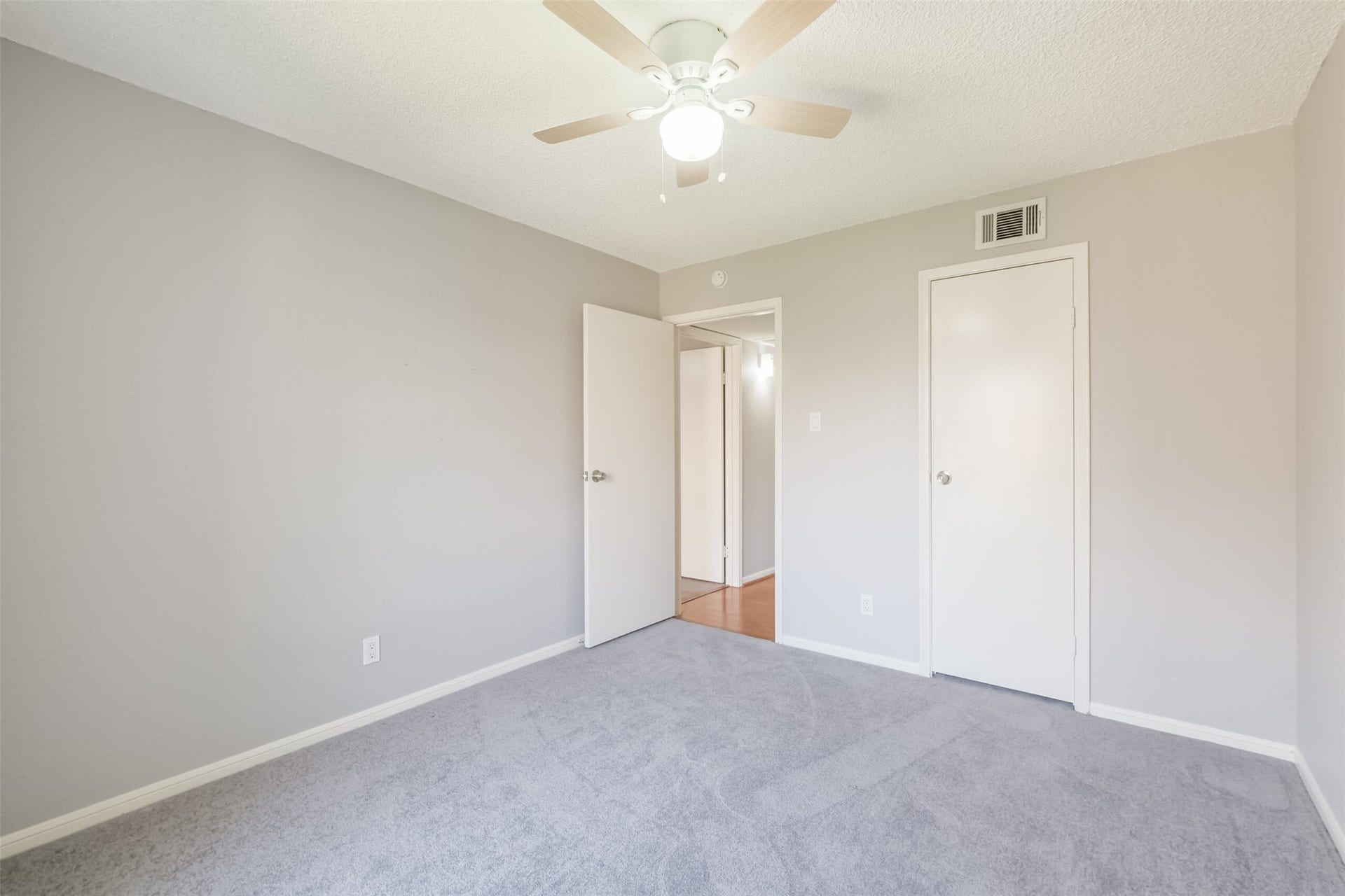 3100 Jeanetta Street, #1204, Houston, TX 77063 econdary bedroom featuring carpet and a ceiling fanperfect for a guest room, home office, or exercise space!