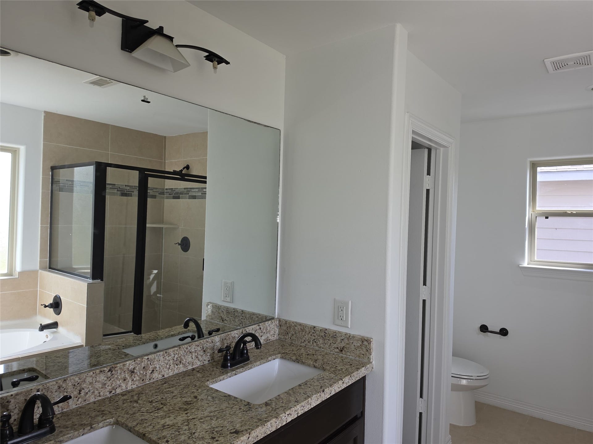 7202 Foxmoor Lake Court, Humble, TX 77338 Primary bath with double vanity, soaking tub, and separate shower.