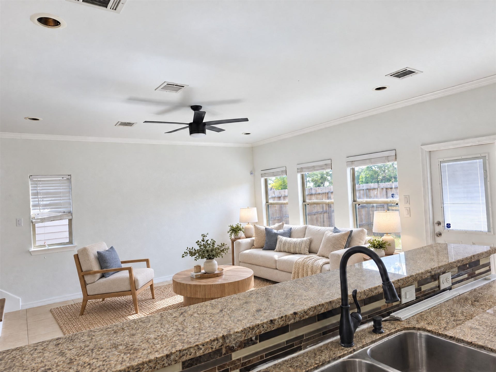 7202 Foxmoor Lake Court, Humble, TX 77338 Staged view from the kitchen into the light-filled living area.