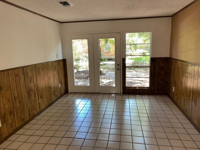 4730 Charles Street, Pasadena, TX 77586 A view of the dining area just off the kitchen. There is a deck area outside the door with lush shade trees.