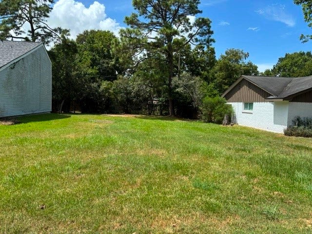 4730 Charles Street, Pasadena, TX 77586 A view of the vacant lot next to the home that is not part of the sale but could be added. Perfect place for a pool or a place to park your RV.