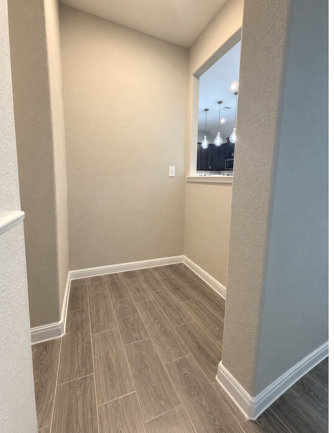 Convenient pocket office nook located near the kitchen, offering a dedicated space for working from home, studying, or everyday organization.