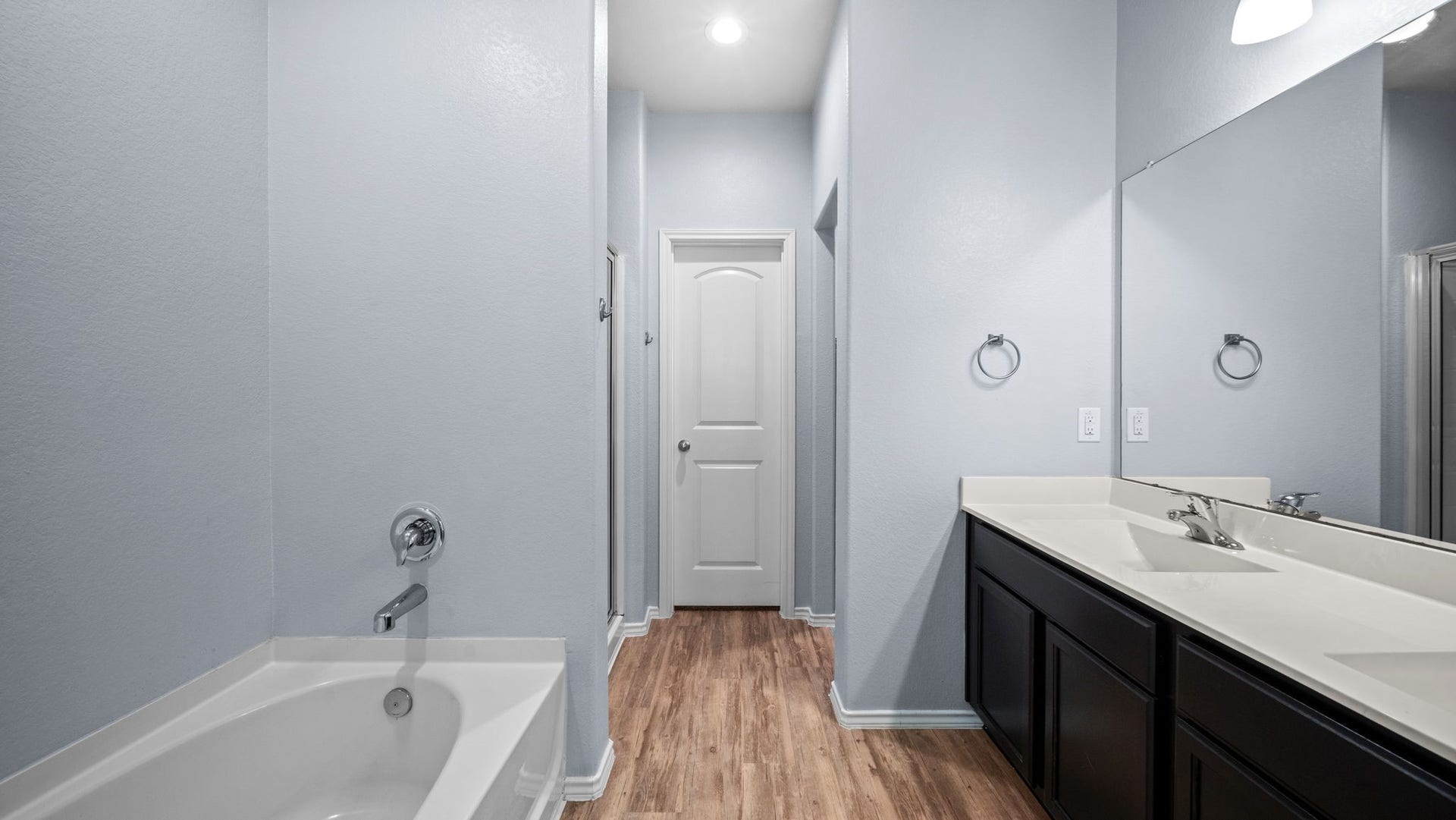 11502 Castle Nugent Court, Conroe, TX 77304 Unwind after a long day with a relaxing soak in the primary bathroom's separate bathtub.