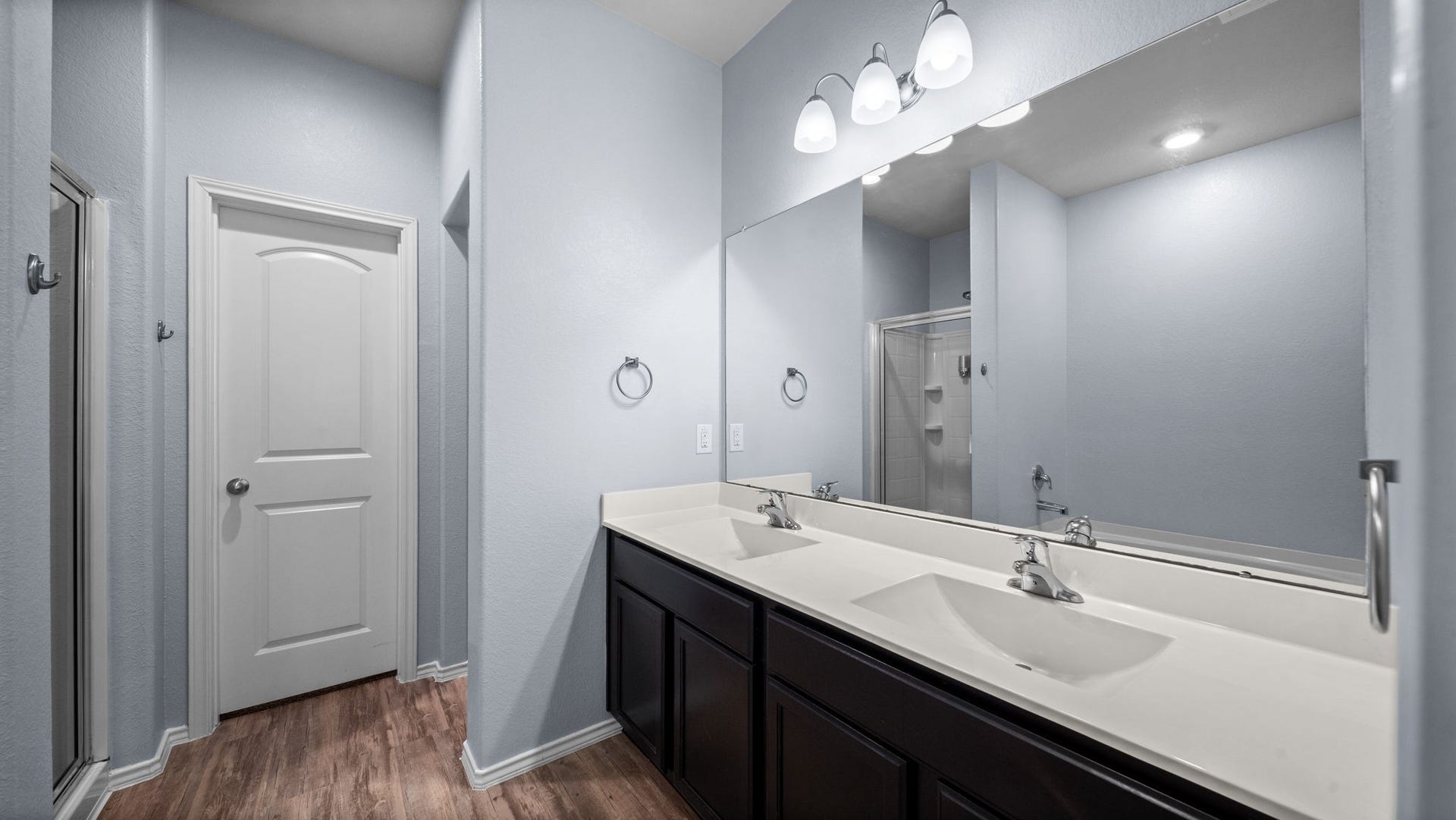 11502 Castle Nugent Court, Conroe, TX 77304 Start your day with ease in the primary bathroom featuring a spacious double-sink vanity.