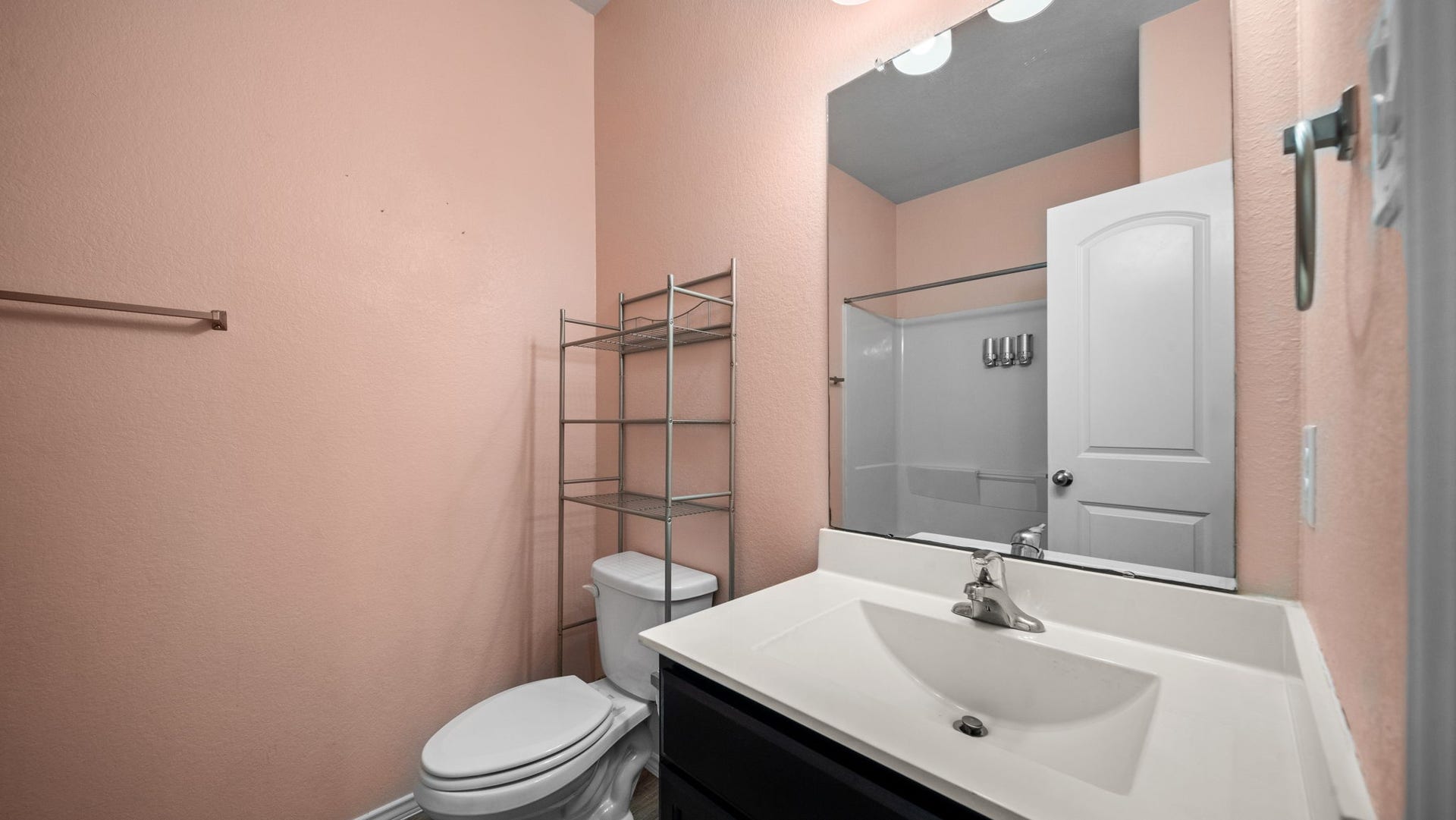 11502 Castle Nugent Court, Conroe, TX 77304 Convenient secondary bathroom features a tub and shower combination for everyday comfort.