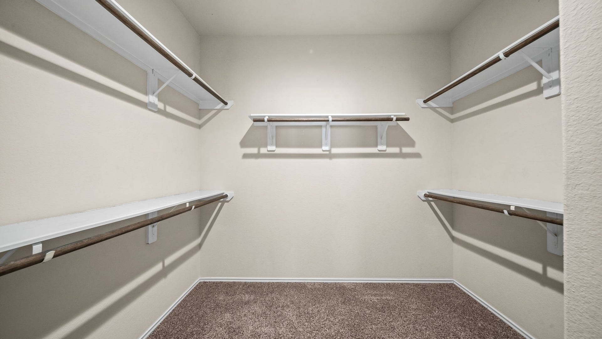 11502 Castle Nugent Court, Conroe, TX 77304 Room for your wardrobe and more! Generous primary walk-in closet features built-in shelving for organized storage.